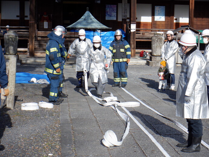 写真：ホース延長訓練の様子